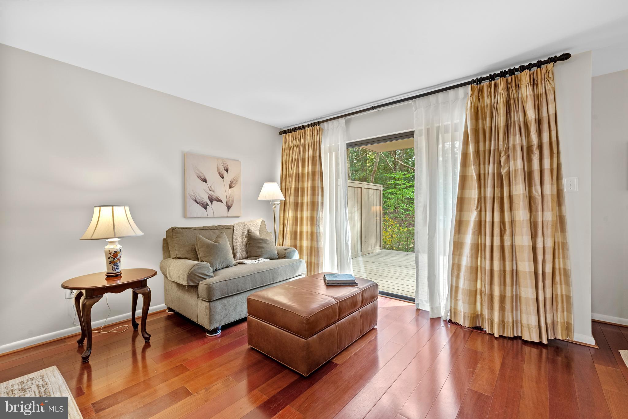 11711 Newbridge Court Reston, VA 20191 - Photo 17 of 37 a living room with furniture and a large window