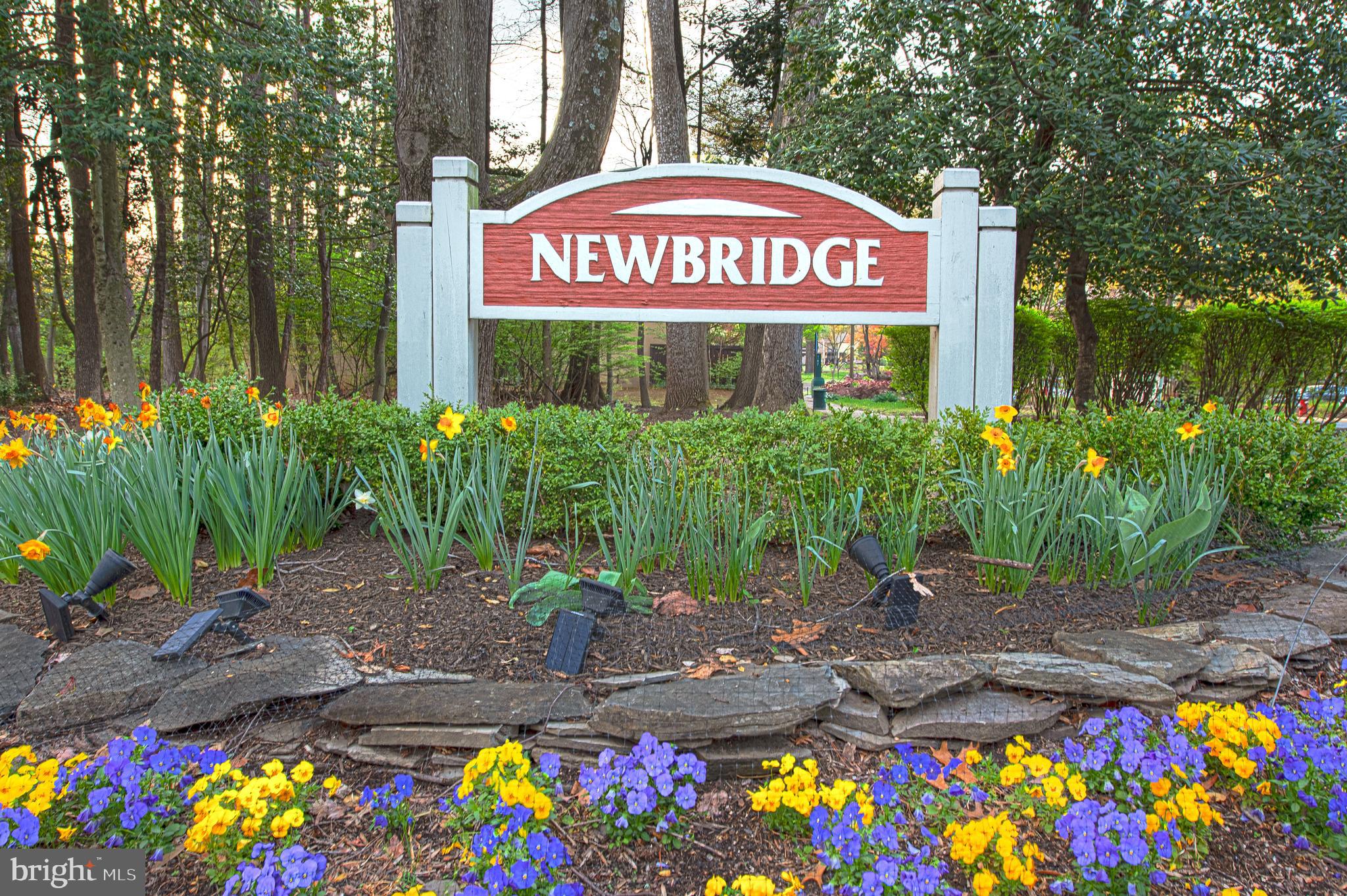 11711 Newbridge Court Reston, VA 20191 - Photo 34 of 37 a sign that is sitting in front of flowers