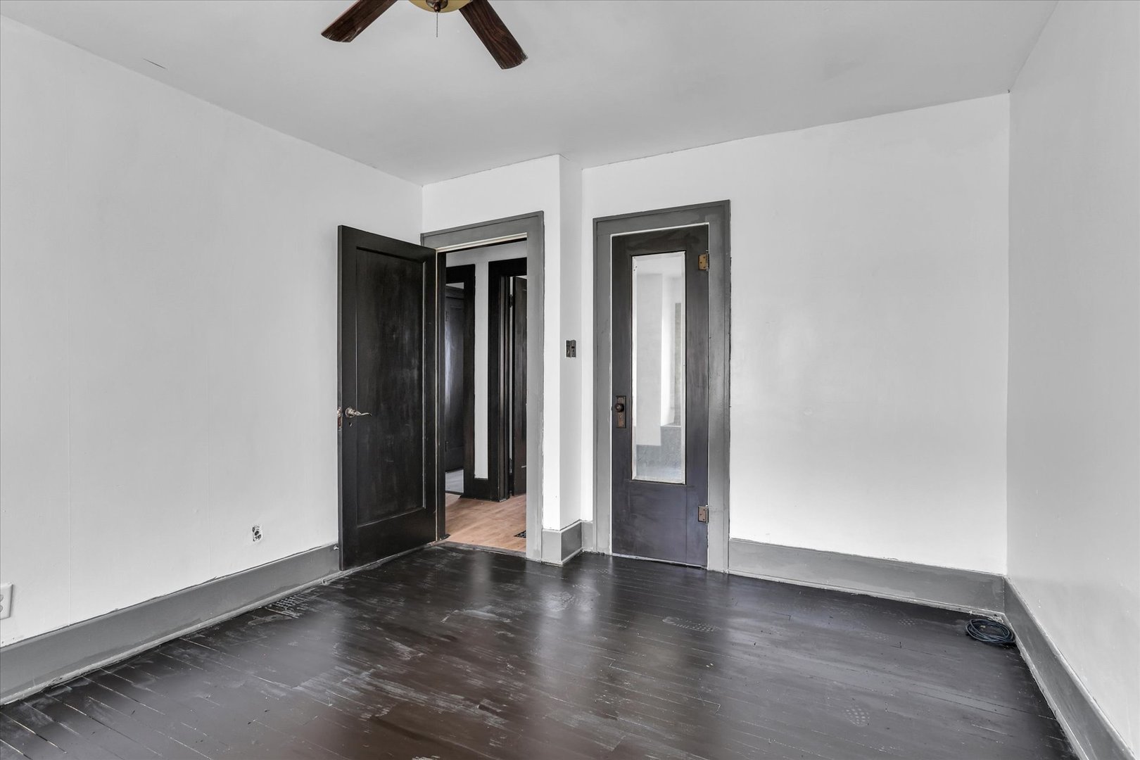 1504 North Monroe Street Decatur, IL 62526 - Photo 23 of 36 an empty room with closet and a chandelier fan