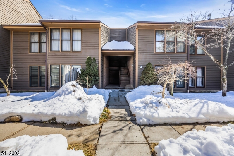 a view of a couches and a fireplace in the patio