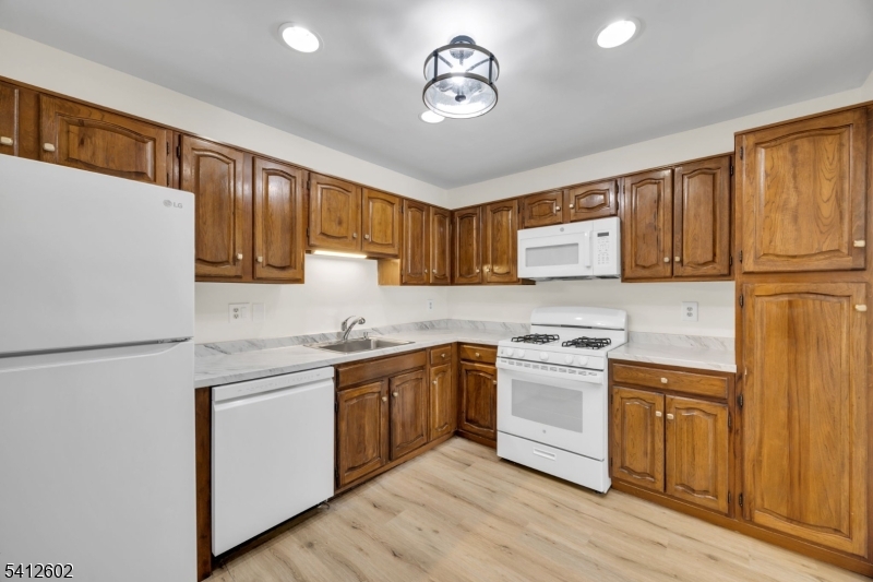 113 Heather Court Edison, NJ 08820 - Photo 12 of 30 a kitchen with stainless steel appliances granite countertop a stove a sink dishwasher and a refrigerator