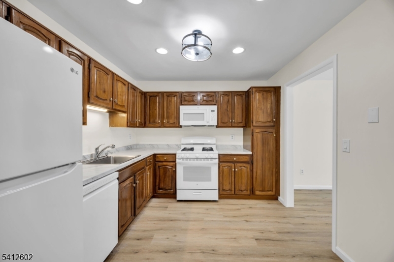 113 Heather Court Edison, NJ 08820 - Photo 13 of 30 a kitchen with a stove top oven sink and cabinets