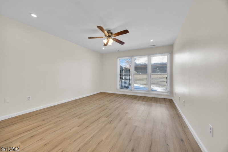 113 Heather Court Edison, NJ 08820 - Photo 14 of 30 wooden floor in an empty room with a window