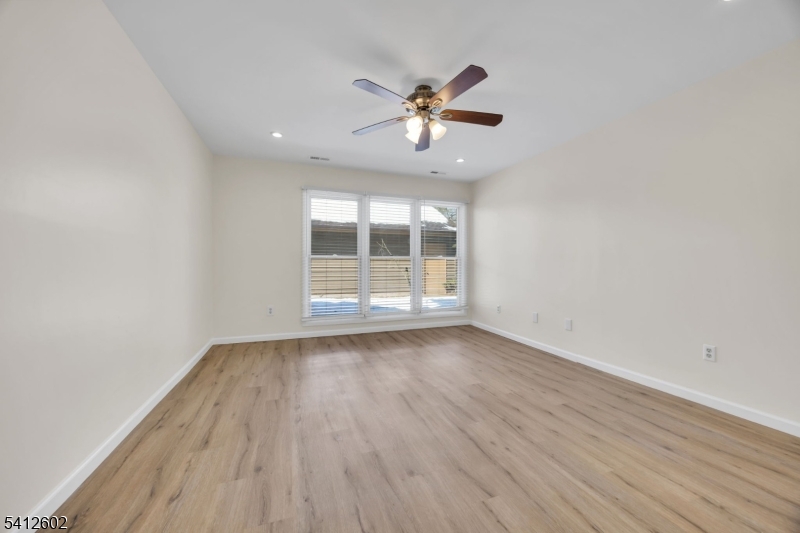 113 Heather Court Edison, NJ 08820 - Photo 15 of 30 wooden floor in an empty room with a window