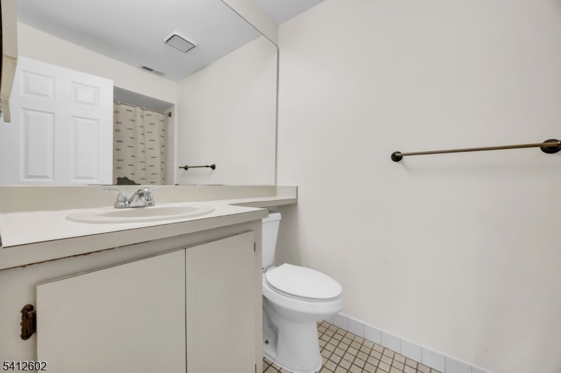 113 Heather Court Edison, NJ 08820 - Photo 17 of 30 a bathroom with a granite countertop sink a toilet and a mirror