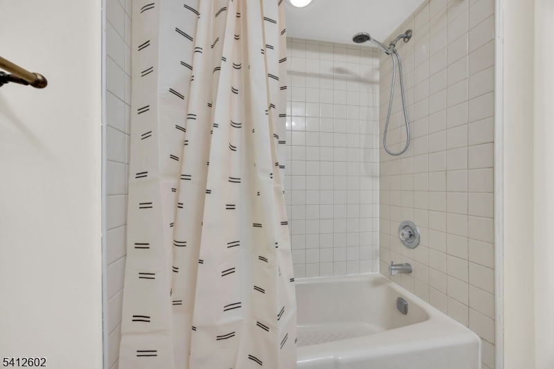 113 Heather Court Edison, NJ 08820 - Photo 18 of 30 a close up of a bathtub curtain