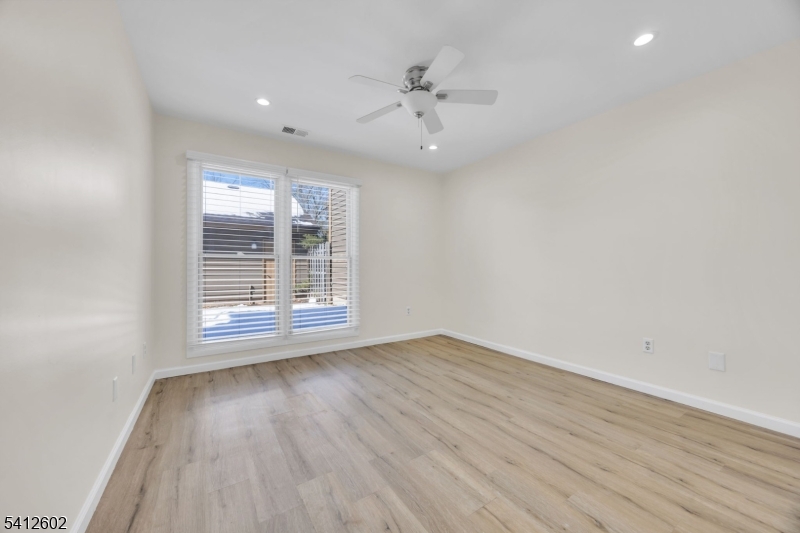 113 Heather Court Edison, NJ 08820 - Photo 19 of 30 wooden floor in an empty room with a window