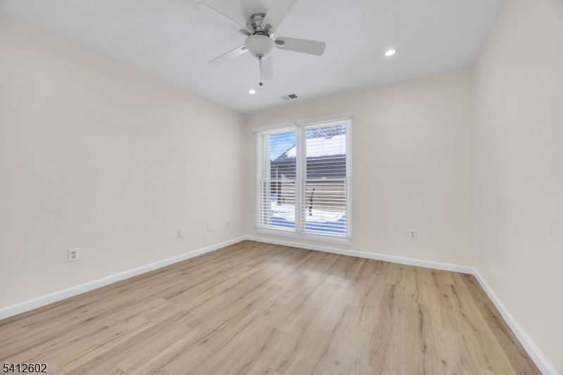 113 Heather Court Edison, NJ 08820 - Photo 20 of 30 an empty room with wooden floor and windows