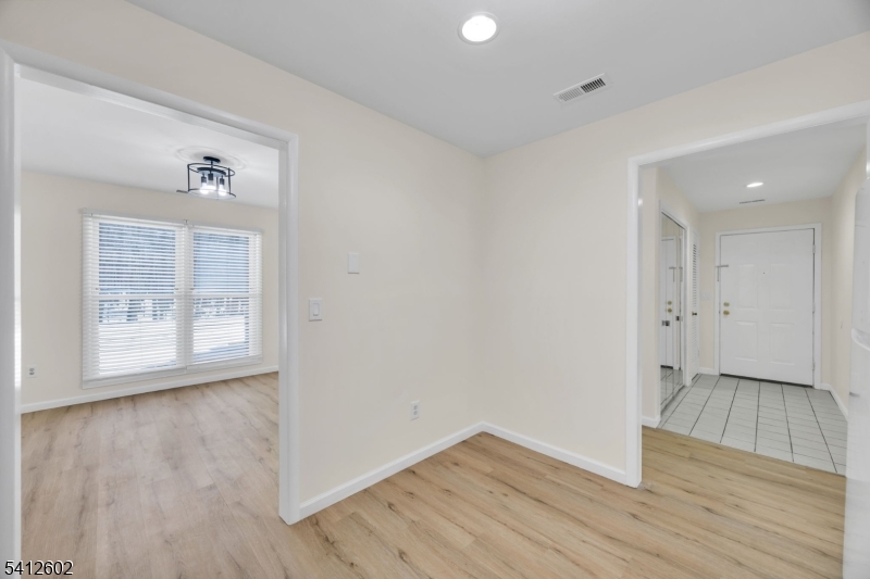 113 Heather Court Edison, NJ 08820 - Photo 2 of 30 an empty room with wooden floor and windows