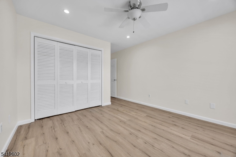 113 Heather Court Edison, NJ 08820 - Photo 21 of 30 an empty room with wooden floor and windows