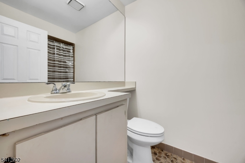 113 Heather Court Edison, NJ 08820 - Photo 22 of 30 a bathroom with a granite countertop toilet sink and mirror
