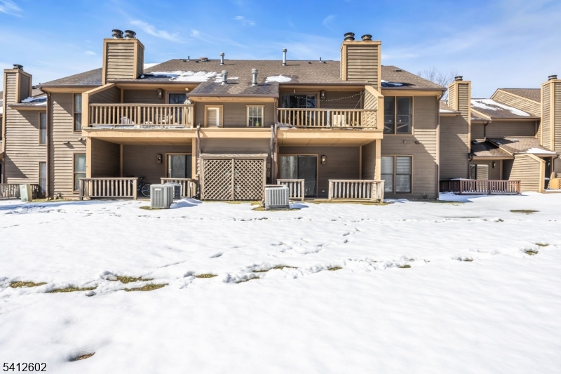 113 Heather Court Edison, NJ 08820 - Photo 27 of 30 a view of a house with a snow in the background