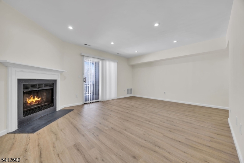 113 Heather Court Edison, NJ 08820 - Photo 4 of 30 a view of an empty room and a fireplace