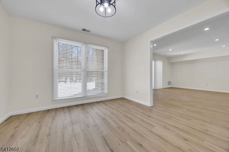 113 Heather Court Edison, NJ 08820 - Photo 7 of 30 an empty room with wooden floor and windows