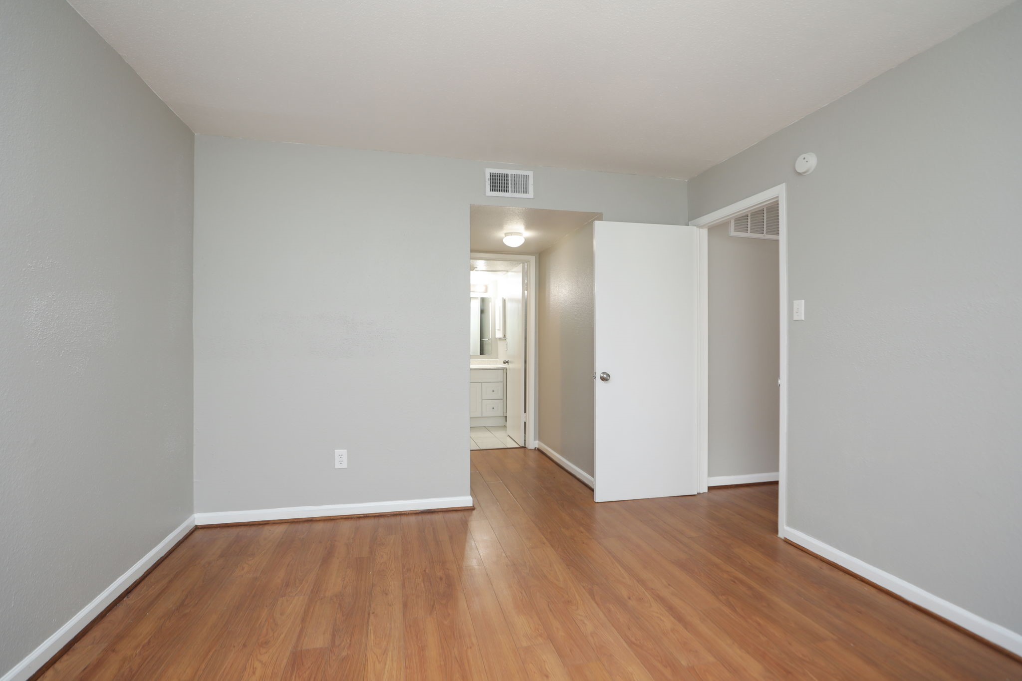 2100 Wilcrest Drive, Unit 127 Houston, TX 77077 - Photo 32 of 38 a view of an empty room with wooden floor