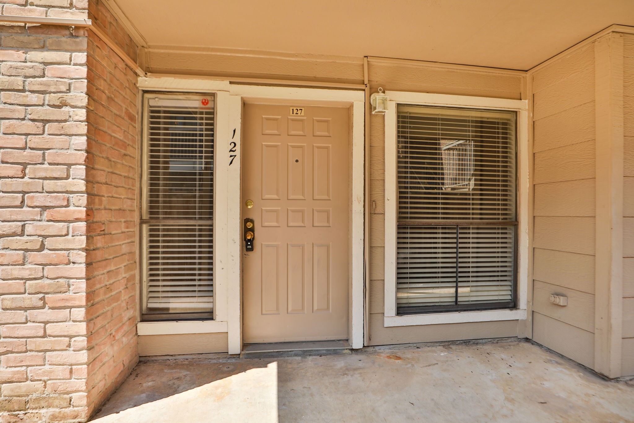 2100 Wilcrest Drive, Unit 127 Houston, TX 77077 - Photo 7 of 38 a view of a porch with a door