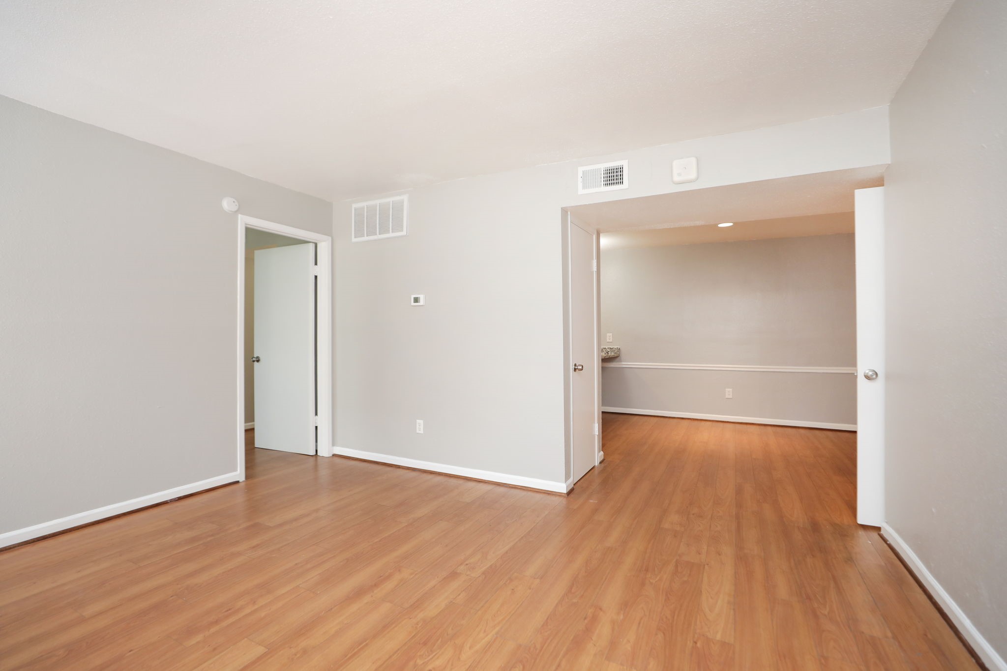 2100 Wilcrest Drive, Unit 127 Houston, TX 77077 - Photo 8 of 38 an empty room with wooden floor & closet