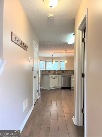 a view of a kitchen with a sink
