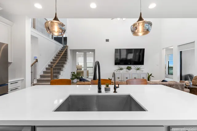 a view of a living room and a flat screen tv