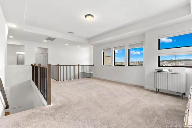 a view of a kitchen with a sink and dishwasher a refrigerator a window