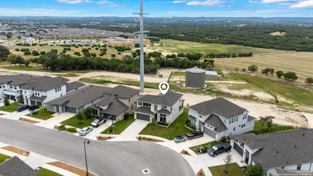 an aerial view of a house with a ocean view