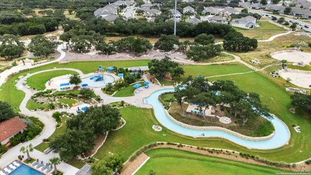 an aerial view of a swimming pool and outdoor space