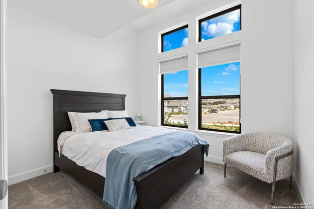 a bedroom with a bed and a couch