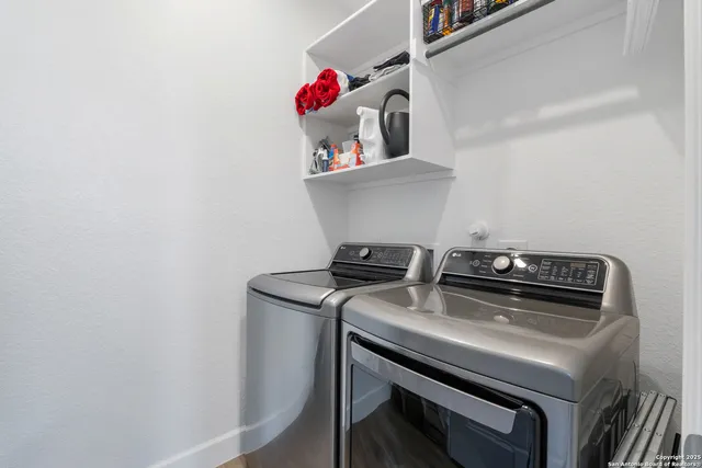 a view of storage and utility room with washer and dryer