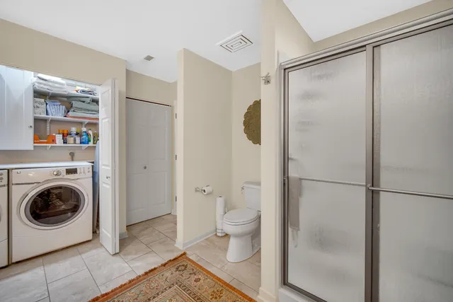 a bathroom with a shower and a toilet