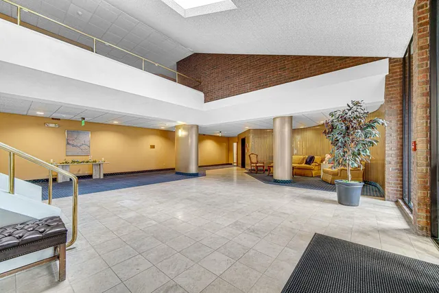 a view of a room with gym equipment and a table