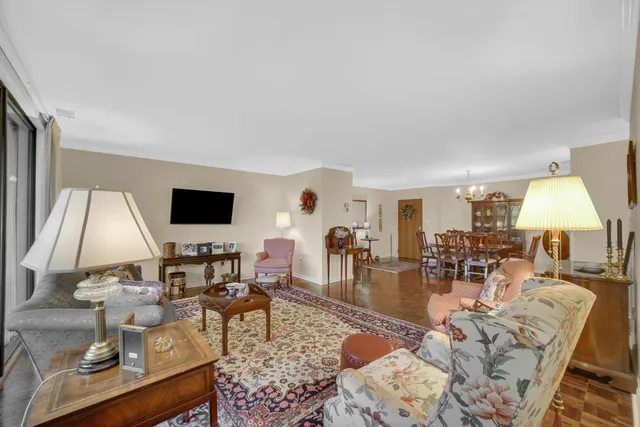a living room with fireplace furniture and a flat screen tv