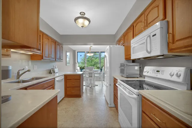 a kitchen that has a sink and a stove in it