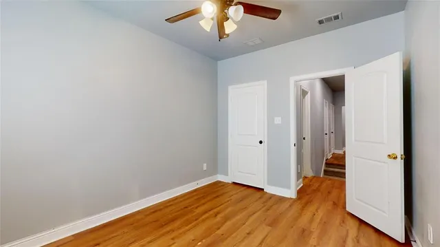 a view of room with wooden floor