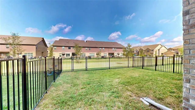 a view of a park with a large tree
