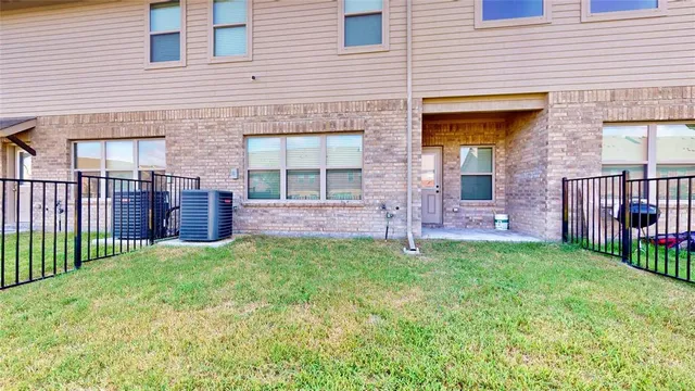 a view of a house with a yard and front of house