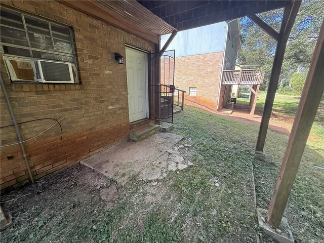 a view of a back yard from a room