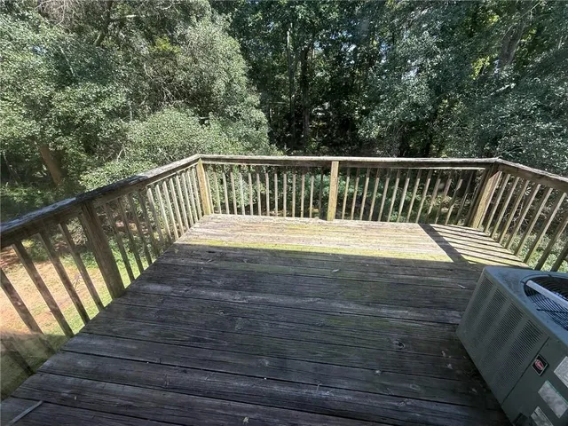 a balcony with wooden floor