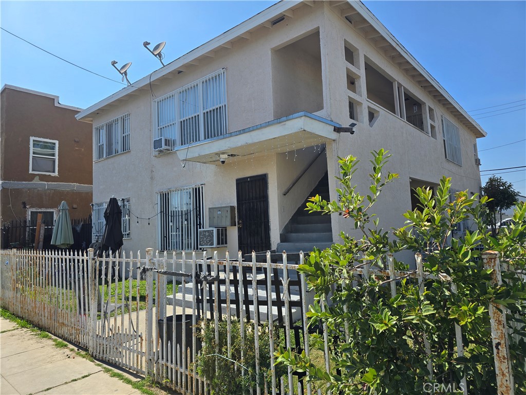 301 West Magnolia Street Compton, CA 90220 - Photo 4 of 6 a front view of a house with glass windows