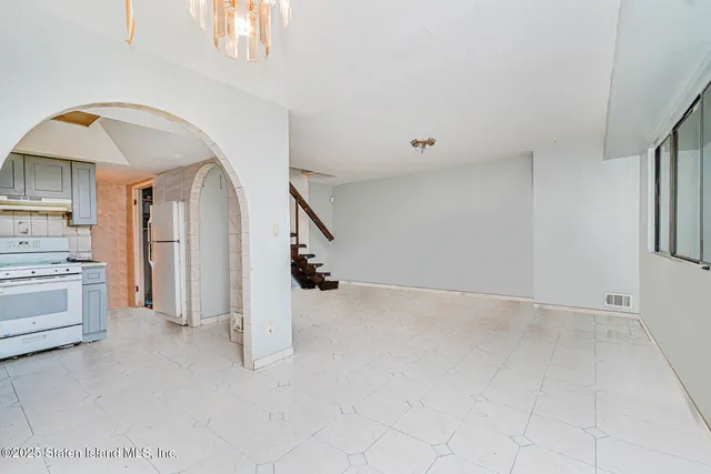 a view of a livingroom with a staircase