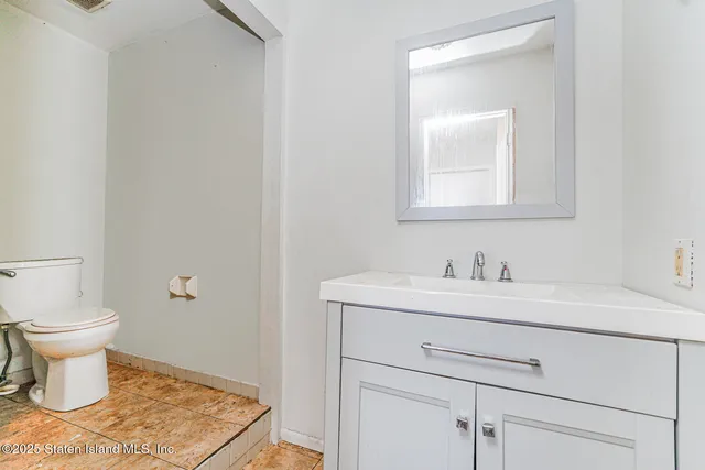 a bathroom with a toilet and bathtub