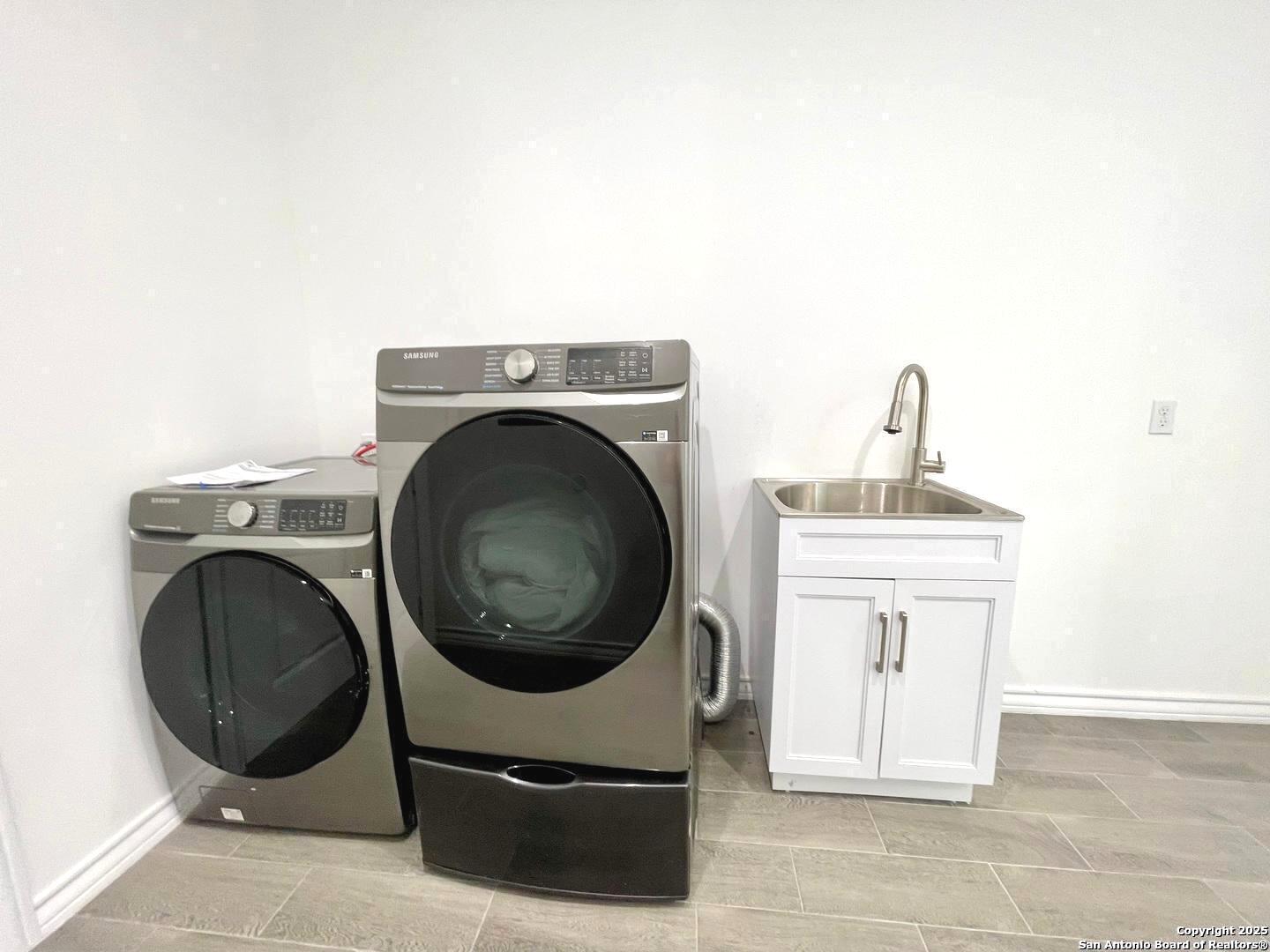 97 Berwick Road Victoria, TX 77904 - Photo 25 of 35 a utility room with sink dryer and washer