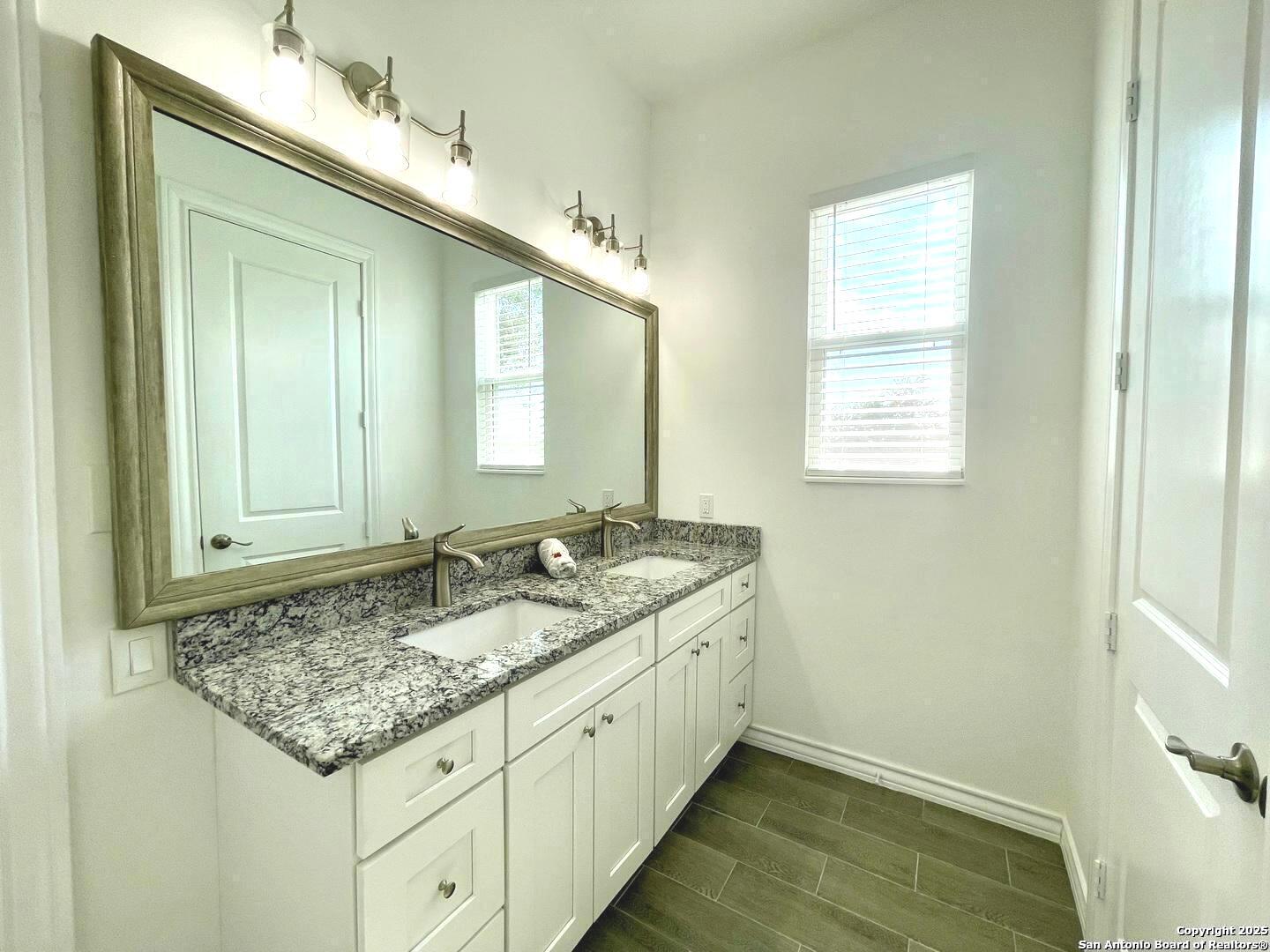 97 Berwick Road Victoria, TX 77904 - Photo 26 of 35 a bathroom with a granite countertop sink and a mirror