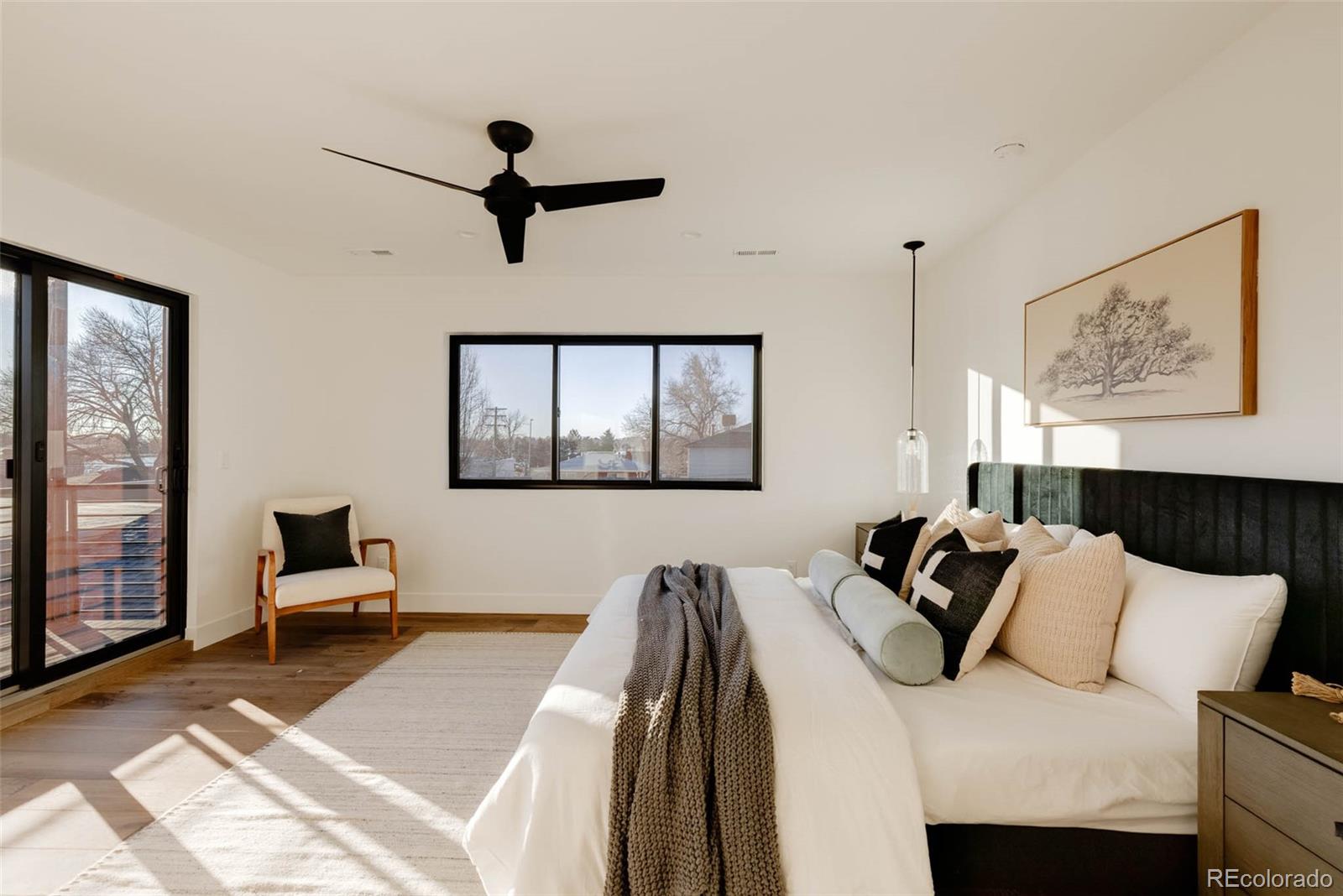 2490 Wolff Street Denver, CO 80212 - Photo 23 of 41 a bedroom with a bed and wooden floor