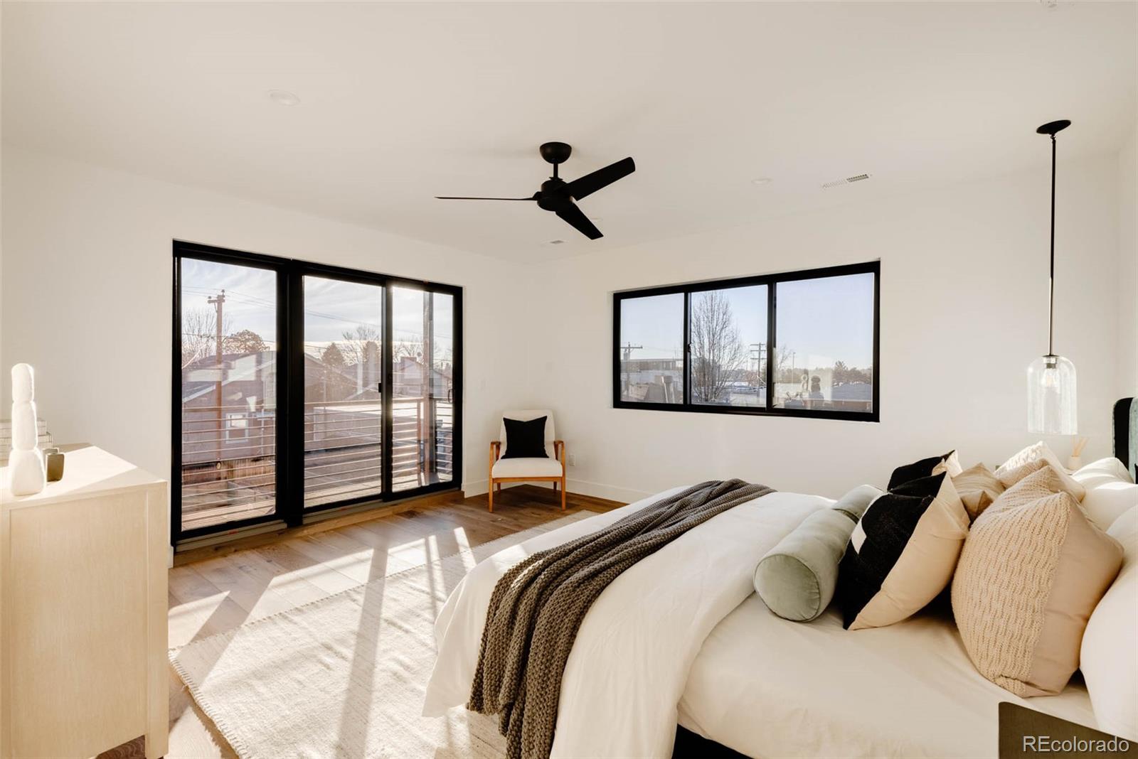 2490 Wolff Street Denver, CO 80212 - Photo 24 of 41 a bedroom with a large bed and a large window