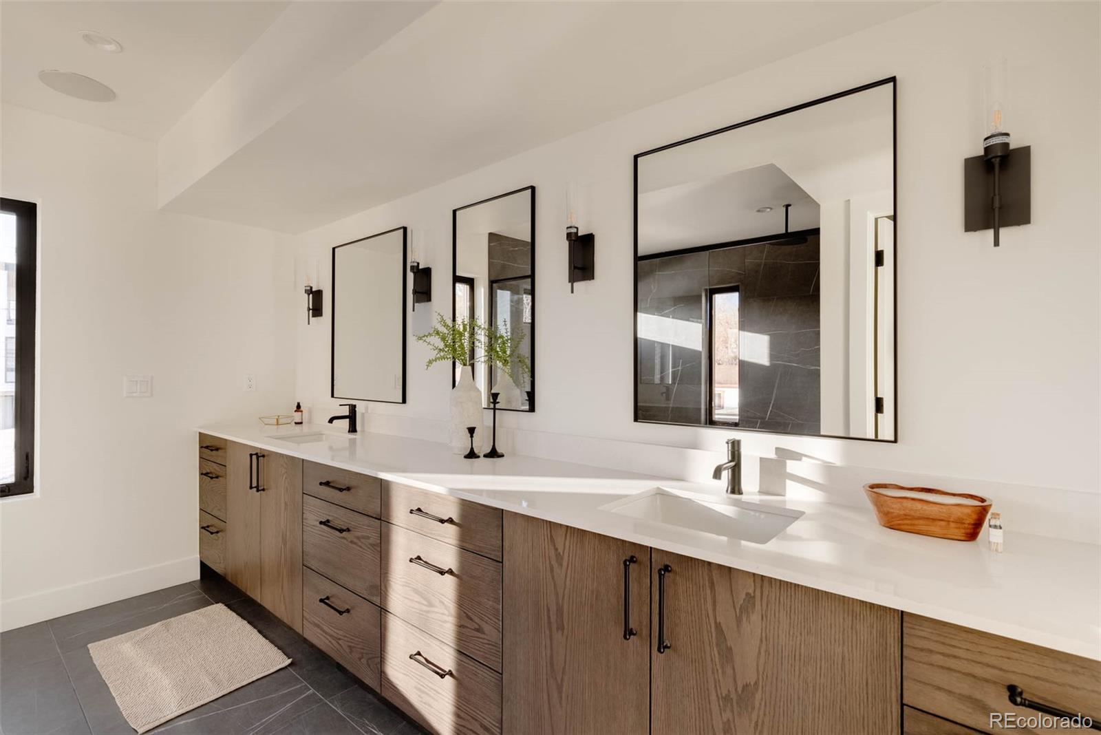 2490 Wolff Street Denver, CO 80212 - Photo 25 of 41 a bathroom with 2 sink tub and a mirror