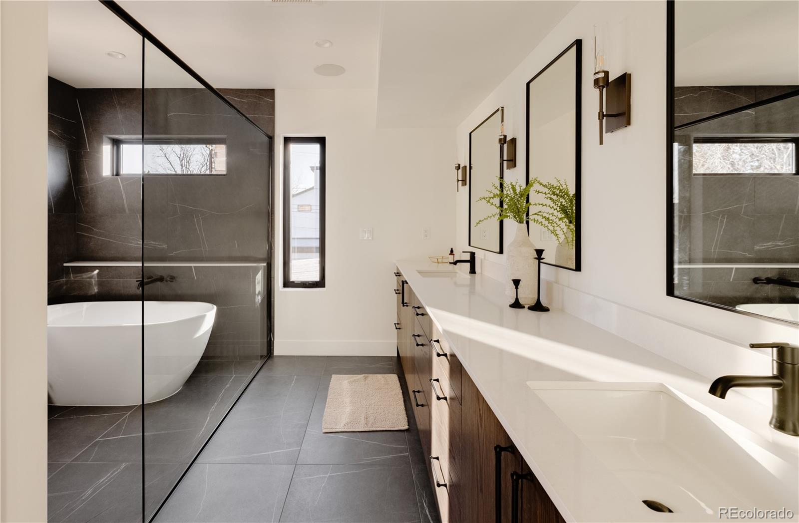 2490 Wolff Street Denver, CO 80212 - Photo 27 of 41 a bathroom with a tub sink and mirror