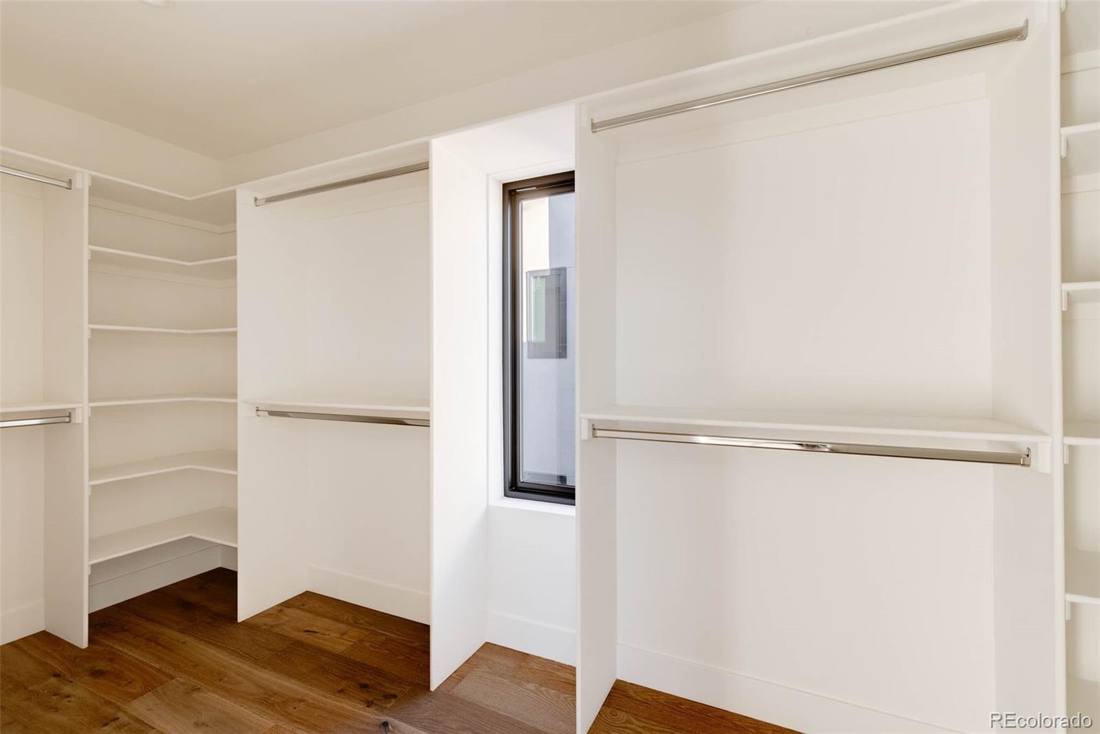 2490 Wolff Street Denver, CO 80212 - Photo 28 of 41 a view of walk in closet with empty racks