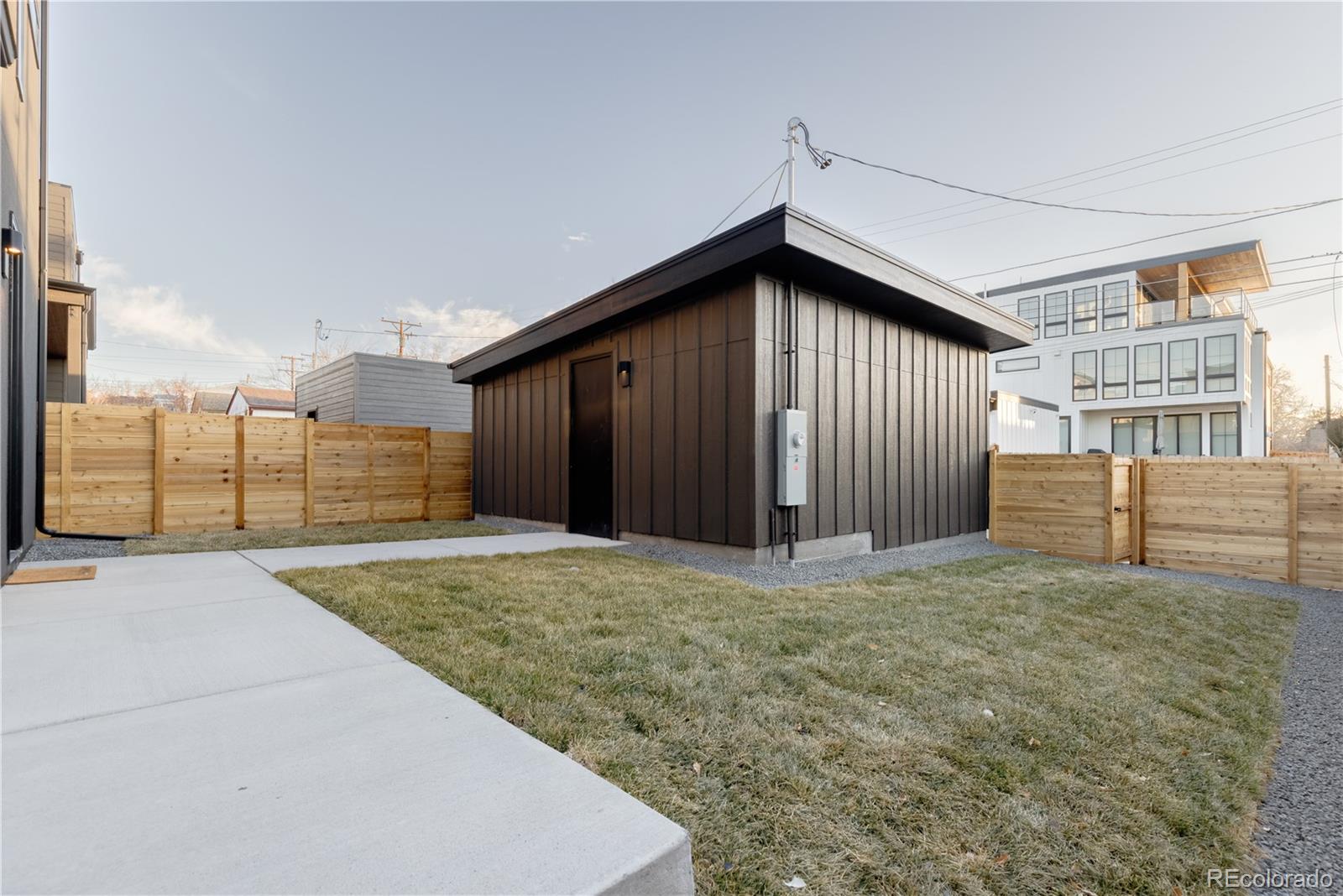 2490 Wolff Street Denver, CO 80212 - Photo 32 of 41 a front view of a house with garage