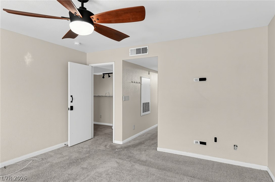 1575 West Warm Springs Road, Unit 2212 Henderson, NV 89014 - Photo 14 of 29 Warm neutral walls and soft plush carpeting define this versatile bedroom space.