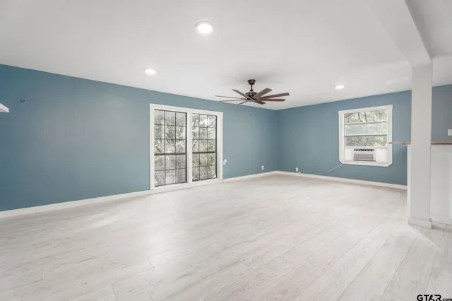 a view of an empty room with a window